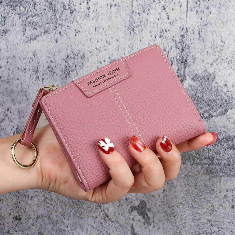 Petit portefeuille à coutures apparentes