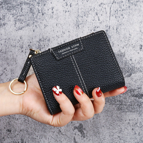 Petit portefeuille à coutures apparentes