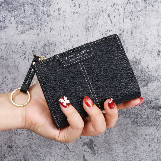 Petit portefeuille à coutures apparentes