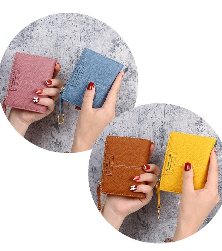 Petit portefeuille à coutures apparentes