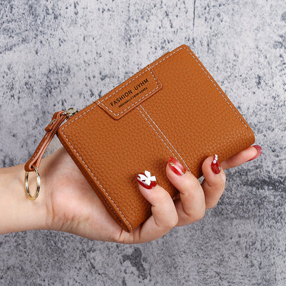 Petit portefeuille à coutures apparentes