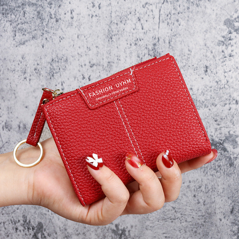 Petit portefeuille à coutures apparentes