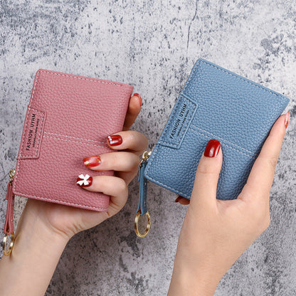 Petit portefeuille à coutures apparentes