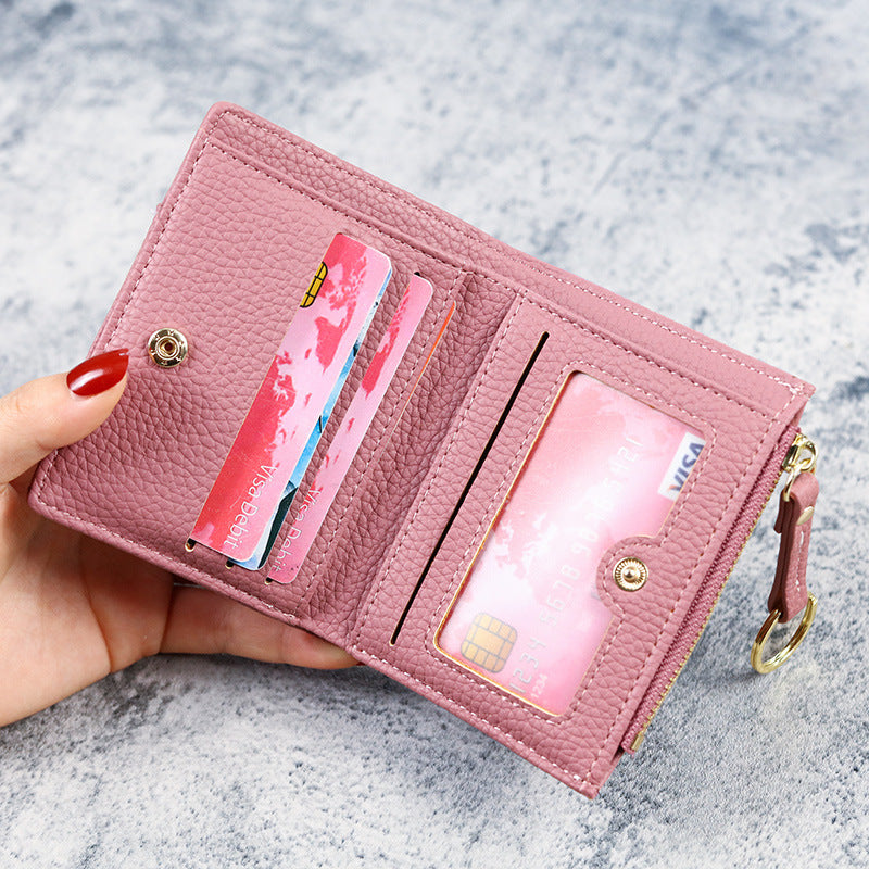 Petit portefeuille à coutures apparentes